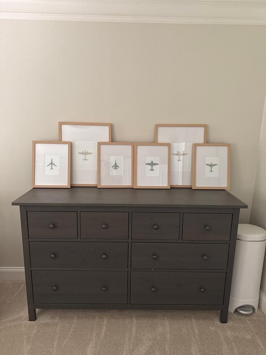 Customer photo of a Design South airplane nursery wall art print set of 6 in neutral colors, framed on a dresser.