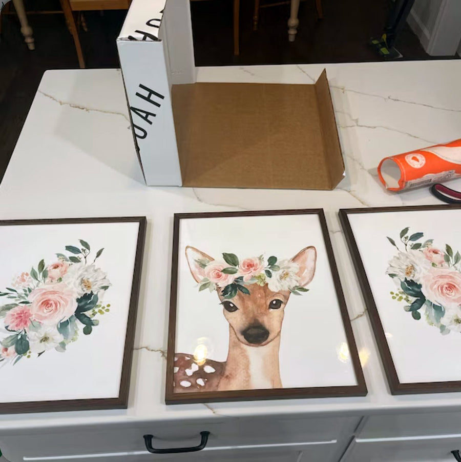 Customer photo of Design South floral deer and rose nursery prints just unpacked from their branded shipping tube.