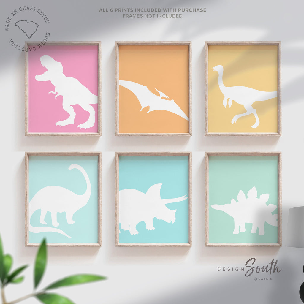 Pastel dinosaur wall art perfect for kids&#39; rooms, nurseries, or as a party gift. Features colorful, girl-friendly dinosaurs in shades of pink, teal, and soft pastels, adding a whimsical, playful touch to a dinosaur-themed space. Ideal for decorating a nursery, bedroom, or playroom, this pastel dinosaur decor brings a fun and stylish twist to traditional dinosaur art, making it a great gift or accent for any dino-loving little one.