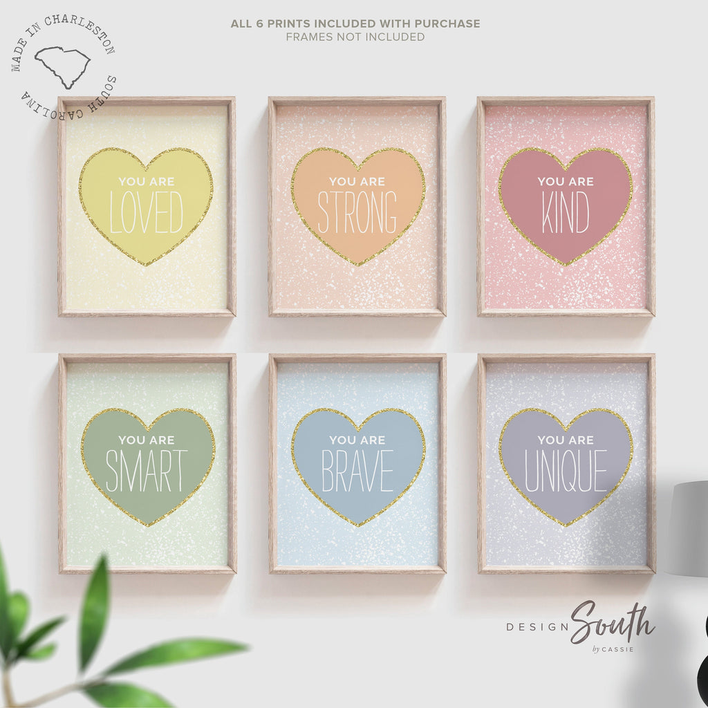 Pastel rainbow heart-themed wall art for girls, featuring soft pastel colors, gold sparkles, and inspirational affirmations. Perfect for a little girl&#39;s bedroom or nursery, this heart-themed decor adds a sweet and uplifting touch. The gentle colors and positive messages create a cheerful and calming space, making it ideal for baby rooms, toddler spaces, or as a thoughtful gift. A beautiful blend of encouragement and whimsical pastel style.