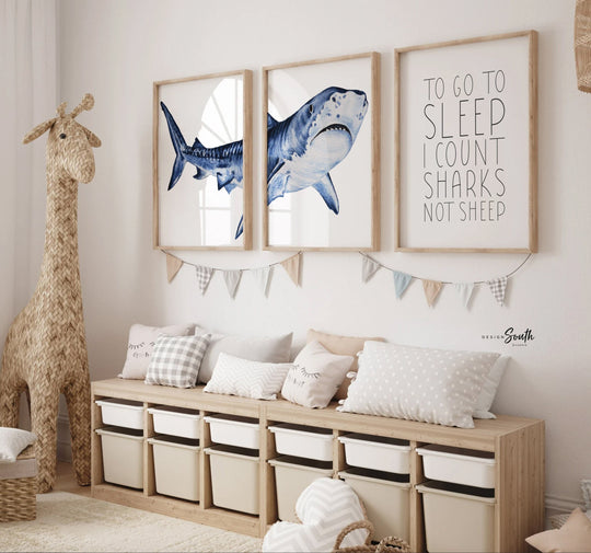 Set of shark-themed nursery wall art prints featuring the quote “To go to sleep I count sharks not sheep.” Perfect for a baby boy’s room or ocean-themed nursery, this playful and modern artwork adds a fun touch to boys' bedrooms or toddler spaces. Includes watercolor-style shark illustrations and bold text, ideal for a shark lover’s room or under-the-sea decor. A great gift for baby showers, birthdays, or parents creating a shark or marine life theme for their little one.