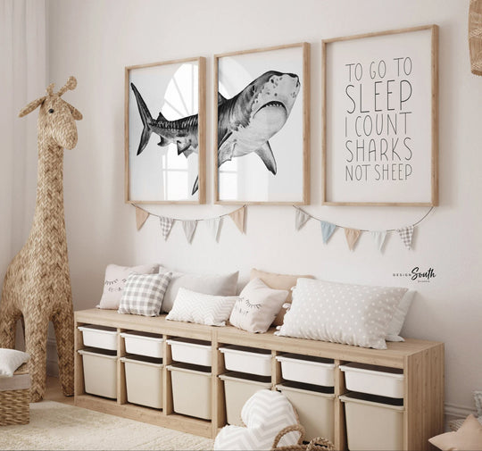 Set of shark-themed nursery wall art prints featuring the quote “To go to sleep I count sharks not sheep.” Perfect for a baby boy’s room or ocean-themed nursery, this playful and modern artwork adds a fun touch to boys' bedrooms or toddler spaces. Includes watercolor-style shark illustrations and bold text, ideal for a shark lover’s room or under-the-sea decor. A great gift for baby showers, birthdays, or parents creating a shark or marine life theme for their little one.