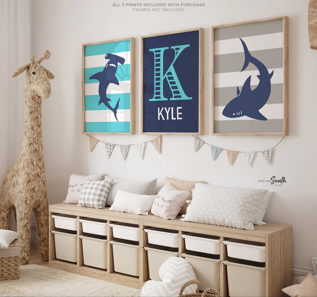 Blue gray shark-themed wall art for a toddler&#39;s room or kids&#39; bedroom. Features a friendly shark design perfect for shark-loving boys. Ideal for a personalized kids&#39; decor, this print includes a monogram or name customization option. Adds a playful, aquatic touch to any boy&#39;s room or nursery and makes a thoughtful gift for a baby shower or birthday. Modern, ocean-inspired design fits any shark theme room and complements existing sea life or ocean art decor.