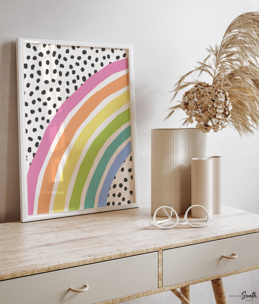 Pastel rainbow art print featuring a personalized name design, perfect for a little girl&#39;s room or baby nursery. This soft and colorful decor adds a whimsical and cheerful touch to any pastel rainbow-themed space. Ideal for baby showers, birthdays, or new arrivals, the gentle rainbow tones create a calming and joyful atmosphere. A sweet and thoughtful accent for a nursery or child’s bedroom with a pastel rainbow decor theme.