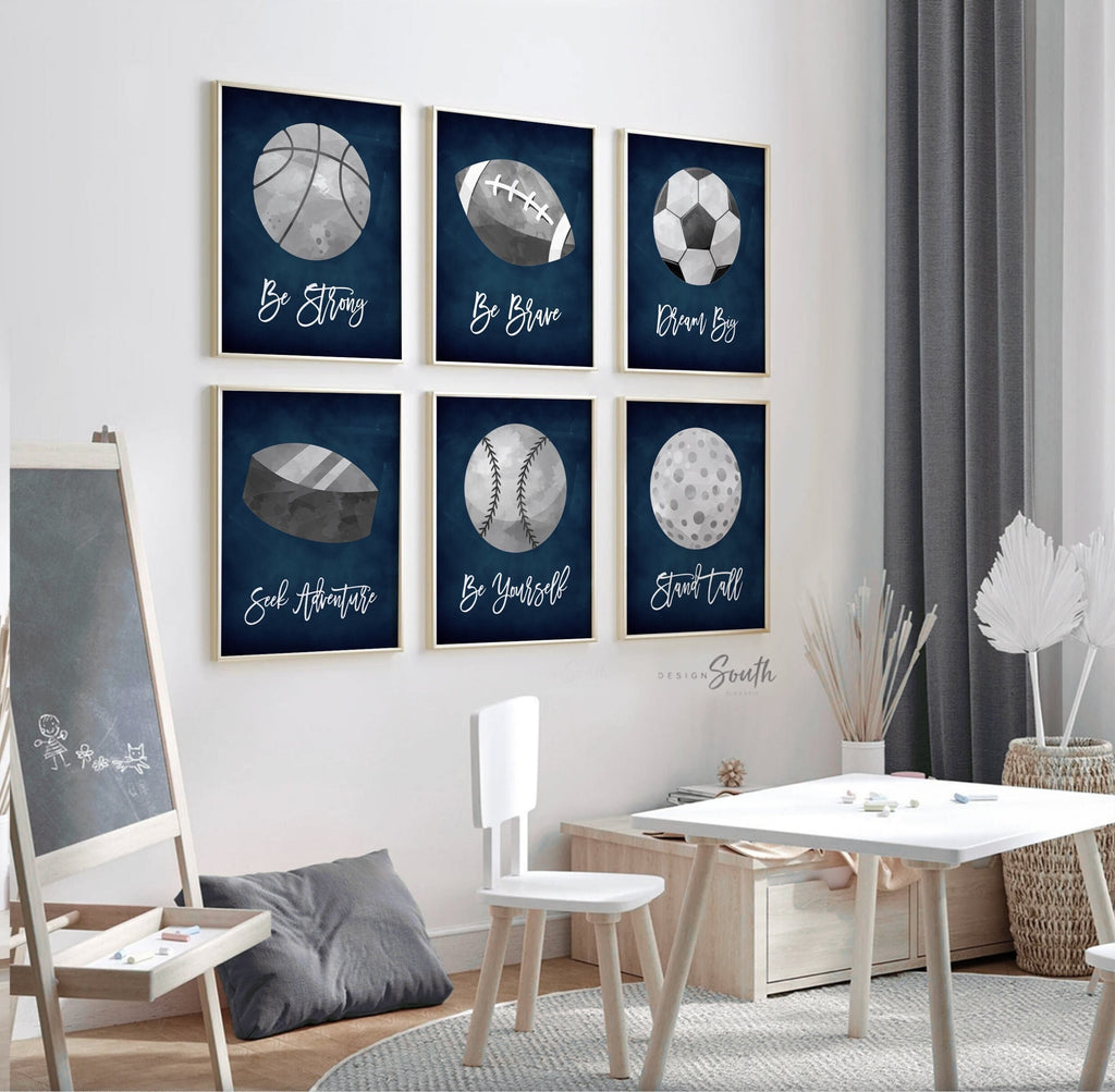 Navy blue and gray sports-themed wall art prints perfect for a boys’ bedroom or nursery. Features various sports elements designed to inspire a love of athletics in kids. Great for a sports-themed boys’ room or as a birthday party gift. Ideal for decorating a baby boy’s nursery or older boy’s sports-themed room with a modern navy and gray color palette. Adds a playful and energetic touch to any space, creating a fun, active environment.