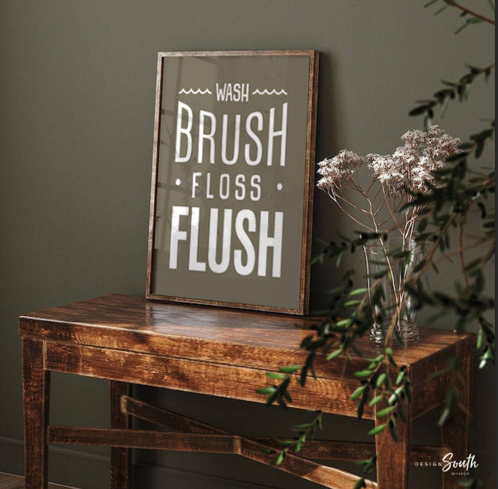 Brown and white bathroom wall art featuring the phrases &quot;wash, brush, floss, flush.&quot; Perfect for a boy’s bathroom or a gender-neutral space, this print brings a simple yet charming touch to any kids’ or guest bathroom. Great for encouraging healthy habits, this design blends well with brown and white decor themes, creating a clean, stylish look that suits both boys’ and girls’ bathrooms.