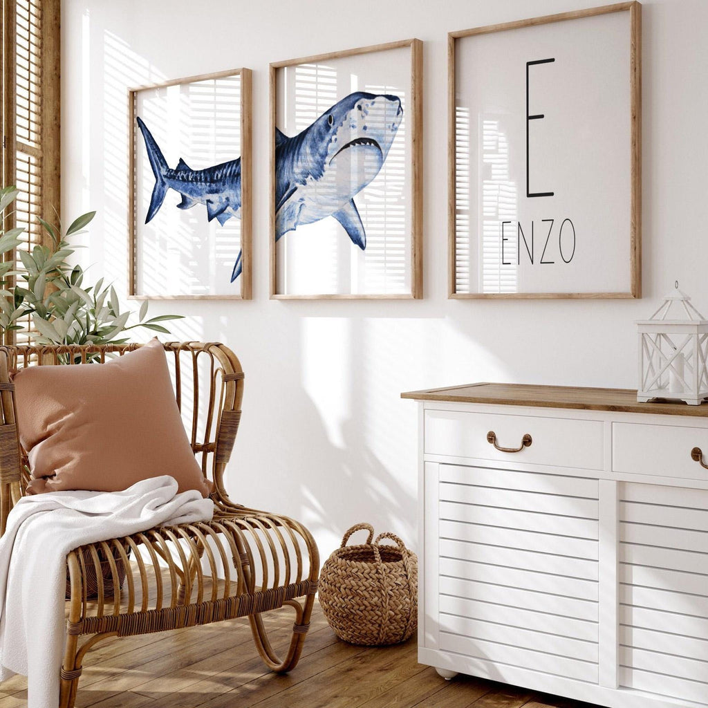 Set of shark-themed nursery wall art prints featuring a personalized boys name. Perfect for a baby boy’s room or ocean-themed nursery, this playful and modern artwork adds a fun touch to boys&#39; bedrooms or toddler spaces. Includes watercolor-style shark illustrations and bold text, ideal for a shark lover’s room or under-the-sea decor. A great gift for baby showers, birthdays, or parents creating a shark or marine life theme for their little one.