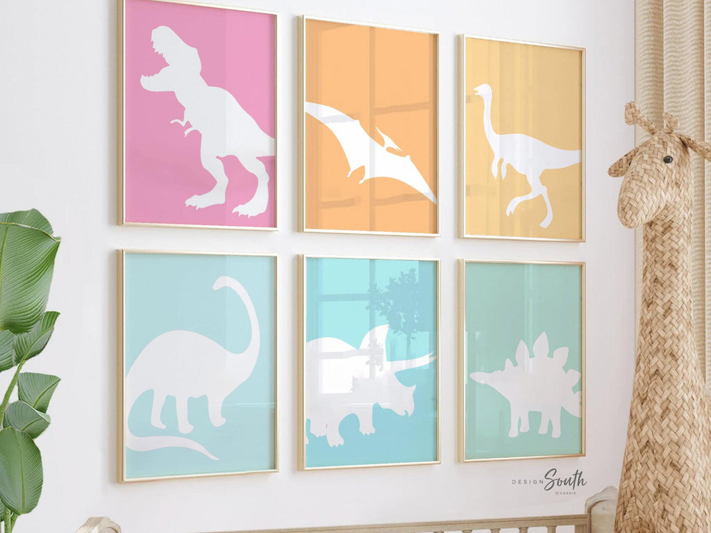 Pastel dinosaur wall art perfect for kids&#39; rooms, nurseries, or as a party gift. Features colorful, girl-friendly dinosaurs in shades of pink, teal, and soft pastels, adding a whimsical, playful touch to a dinosaur-themed space. Ideal for decorating a nursery, bedroom, or playroom, this pastel dinosaur decor brings a fun and stylish twist to traditional dinosaur art, making it a great gift or accent for any dino-loving little one.