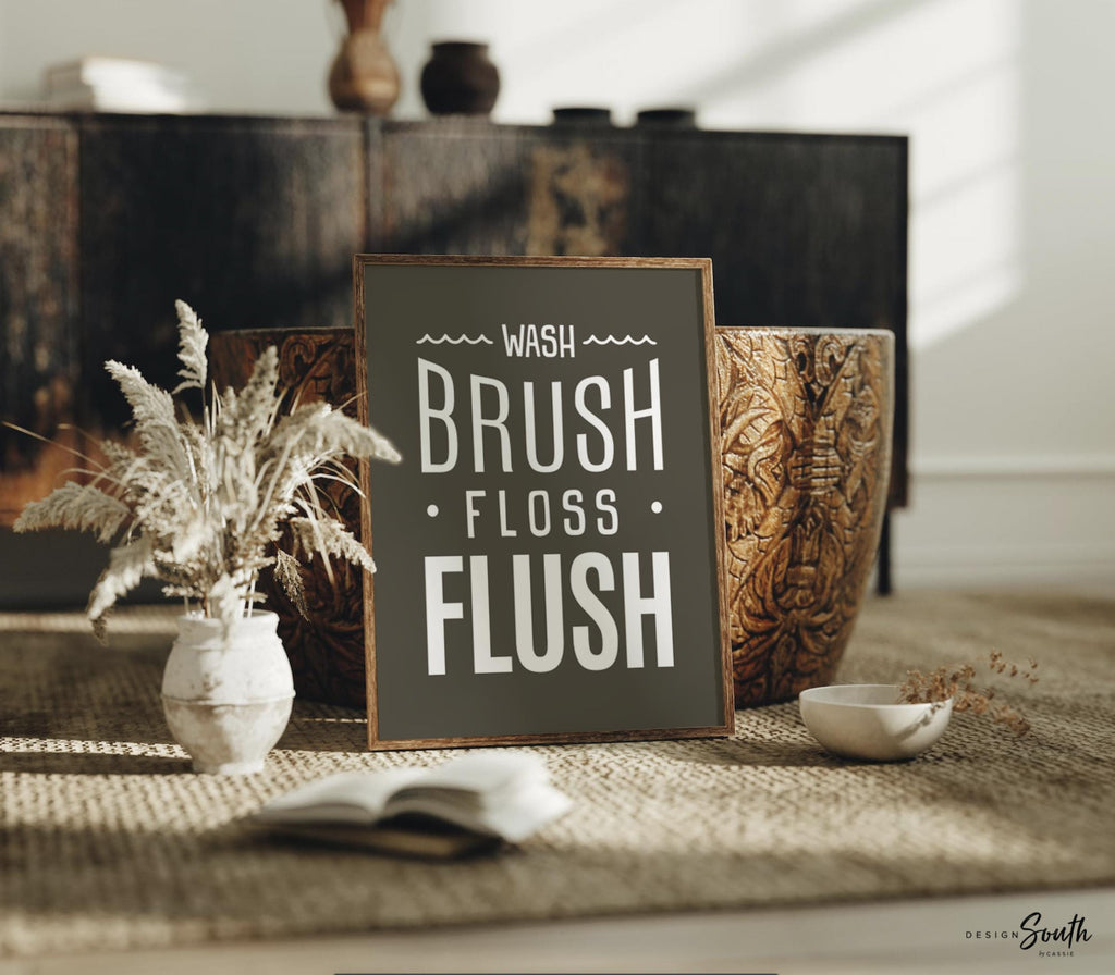 Brown and white bathroom wall art featuring the phrases &quot;wash, brush, floss, flush.&quot; Perfect for a boy’s bathroom or a gender-neutral space, this print brings a simple yet charming touch to any kids’ or guest bathroom. Great for encouraging healthy habits, this design blends well with brown and white decor themes, creating a clean, stylish look that suits both boys’ and girls’ bathrooms.
