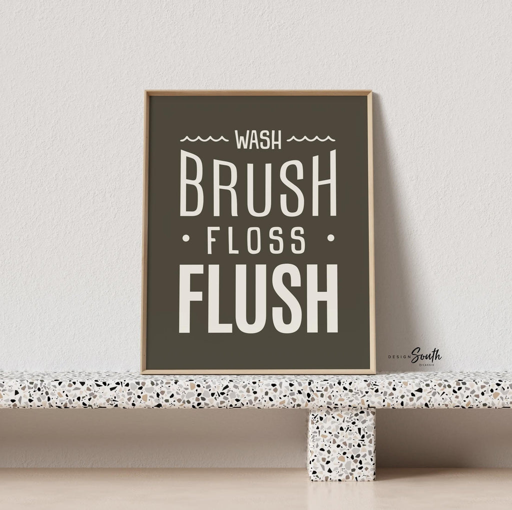 Brown and white bathroom wall art featuring the phrases &quot;wash, brush, floss, flush.&quot; Perfect for a boy’s bathroom or a gender-neutral space, this print brings a simple yet charming touch to any kids’ or guest bathroom. Great for encouraging healthy habits, this design blends well with brown and white decor themes, creating a clean, stylish look that suits both boys’ and girls’ bathrooms.