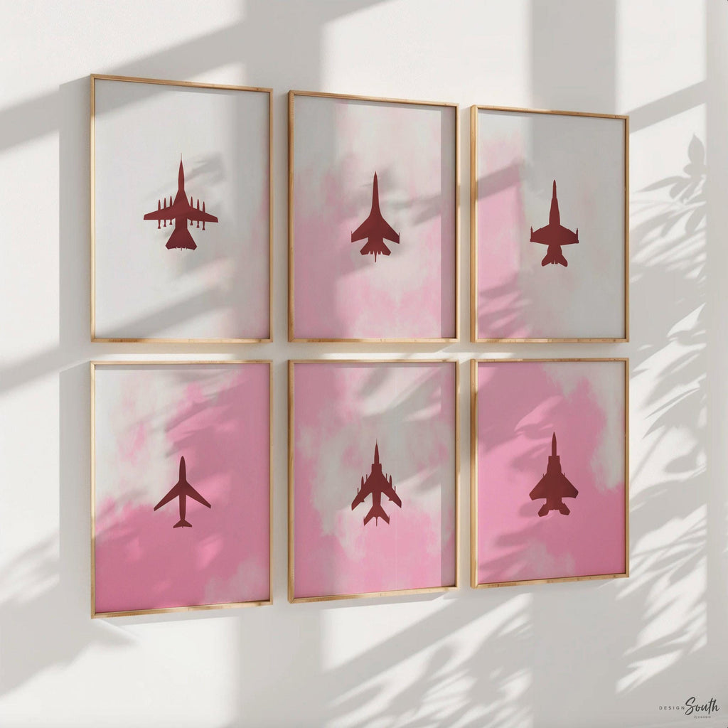 Set of 6 pink airplane art prints perfect for girls&#39; baby or toddler nursery decor. Features edgy aviation-themed designs with fighter jet silhouettes in soft pinks, combining military aircraft with a feminine twist. Ideal for a unique kids&#39; room or aviation lover&#39;s space, this collection offers stylish and modern wall art that blends playful charm with a bold, edgy feel. A distinctive addition to any nursery or playroom decor.