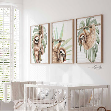 Hanging sloth wall art set featuring charming sloths in a relaxed, tropical rainforest theme. Perfect for a sloth-themed baby nursery, this artwork brings a playful, cozy vibe to any room. Neutral green and gray tones make it versatile for boys’ or girls’ rooms. This set is ideal for adding a whimsical touch to modern nursery decor, creating a peaceful atmosphere that babies and parents will love. Great baby shower gift for jungle-themed nurseries.