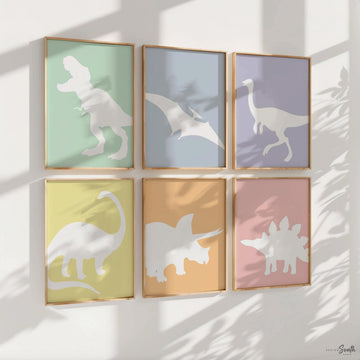 Adorable dinosaur art prints designed for a little girl&#39;s room, featuring playful dinosaurs in shades of pink, teal, and purple. These vibrant and fun dinosaur illustrations are perfect for adding a touch of adventure and charm to toddler wall decor. Ideal for a girl&#39;s nursery, bedroom, or playroom, these art prints create a whimsical colorful space. Perfect for girls who love dinosaurs, this wall decor adds personality and joy to any room setting, making it a delightful addition to her