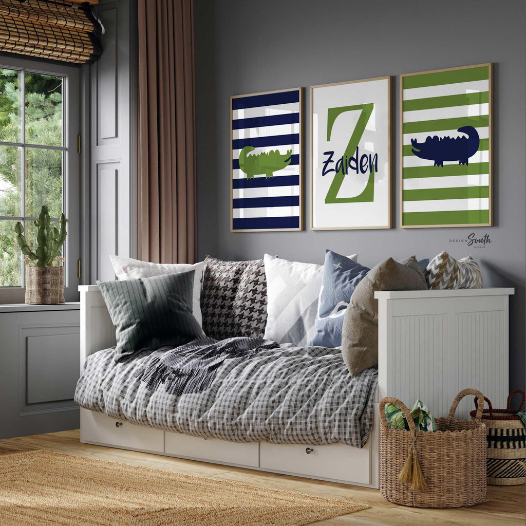 Alligator nursery decor featuring a personalized boy’s name, designed in navy blue and green tones. This playful and charming wall art is perfect for a baby boy’s room or toddler bedroom with a gator or animal theme. Ideal for adding a custom touch to nursery decor, the alligator print brings fun and personality to the space. A great gift idea for baby showers or new parents looking for unique and boyish room decoration ideas.
