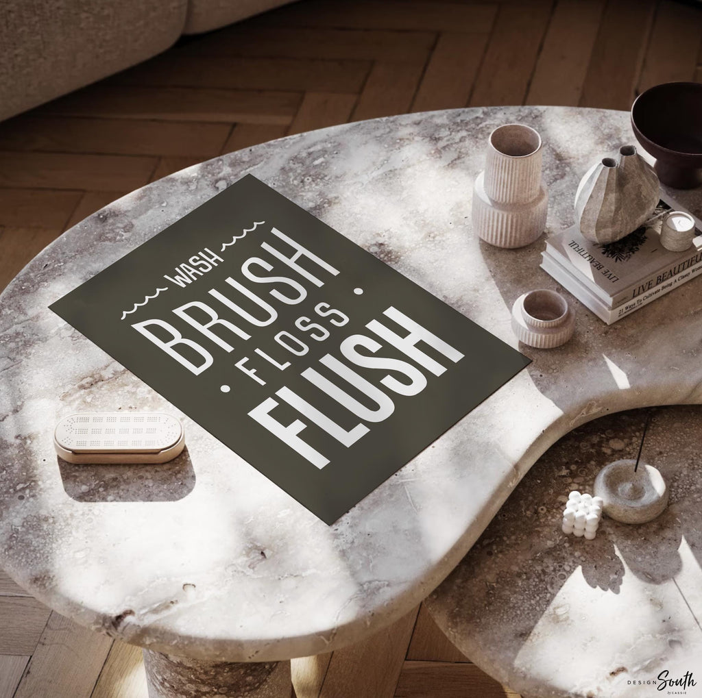 Brown and white bathroom wall art featuring the phrases &quot;wash, brush, floss, flush.&quot; Perfect for a boy’s bathroom or a gender-neutral space, this print brings a simple yet charming touch to any kids’ or guest bathroom. Great for encouraging healthy habits, this design blends well with brown and white decor themes, creating a clean, stylish look that suits both boys’ and girls’ bathrooms.