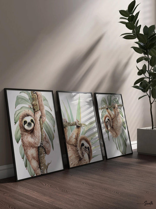 Hanging sloth wall art set featuring charming sloths in a relaxed, tropical rainforest theme. Perfect for a sloth-themed baby nursery, this artwork brings a playful, cozy vibe to any room. Neutral green and gray tones make it versatile for boys’ or girls’ rooms. This set is ideal for adding a whimsical touch to modern nursery decor, creating a peaceful atmosphere that babies and parents will love. Great baby shower gift for jungle-themed nurseries.