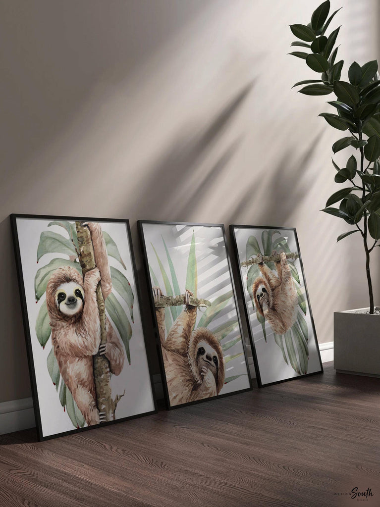 Hanging sloth wall art set featuring charming sloths in a relaxed, tropical rainforest theme. Perfect for a sloth-themed baby nursery, this artwork brings a playful, cozy vibe to any room. Neutral green and gray tones make it versatile for boys’ or girls’ rooms. This set is ideal for adding a whimsical touch to modern nursery decor, creating a peaceful atmosphere that babies and parents will love. Great baby shower gift for jungle-themed nurseries.