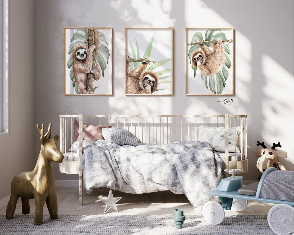 Hanging sloth wall art set featuring charming sloths in a relaxed, tropical rainforest theme. Perfect for a sloth-themed baby nursery, this artwork brings a playful, cozy vibe to any room. Neutral green and gray tones make it versatile for boys’ or girls’ rooms. This set is ideal for adding a whimsical touch to modern nursery decor, creating a peaceful atmosphere that babies and parents will love. Great baby shower gift for jungle-themed nurseries.