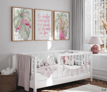 May include: Three framed prints with a tropical theme. The prints feature pink flamingos, green monstera leaves, and a pink pineapple. The center print has a pink quote that reads &#39;Be who God created you to be & you will set the world on fire.&#39; The quote is attributed to St. Catherine of Siena.