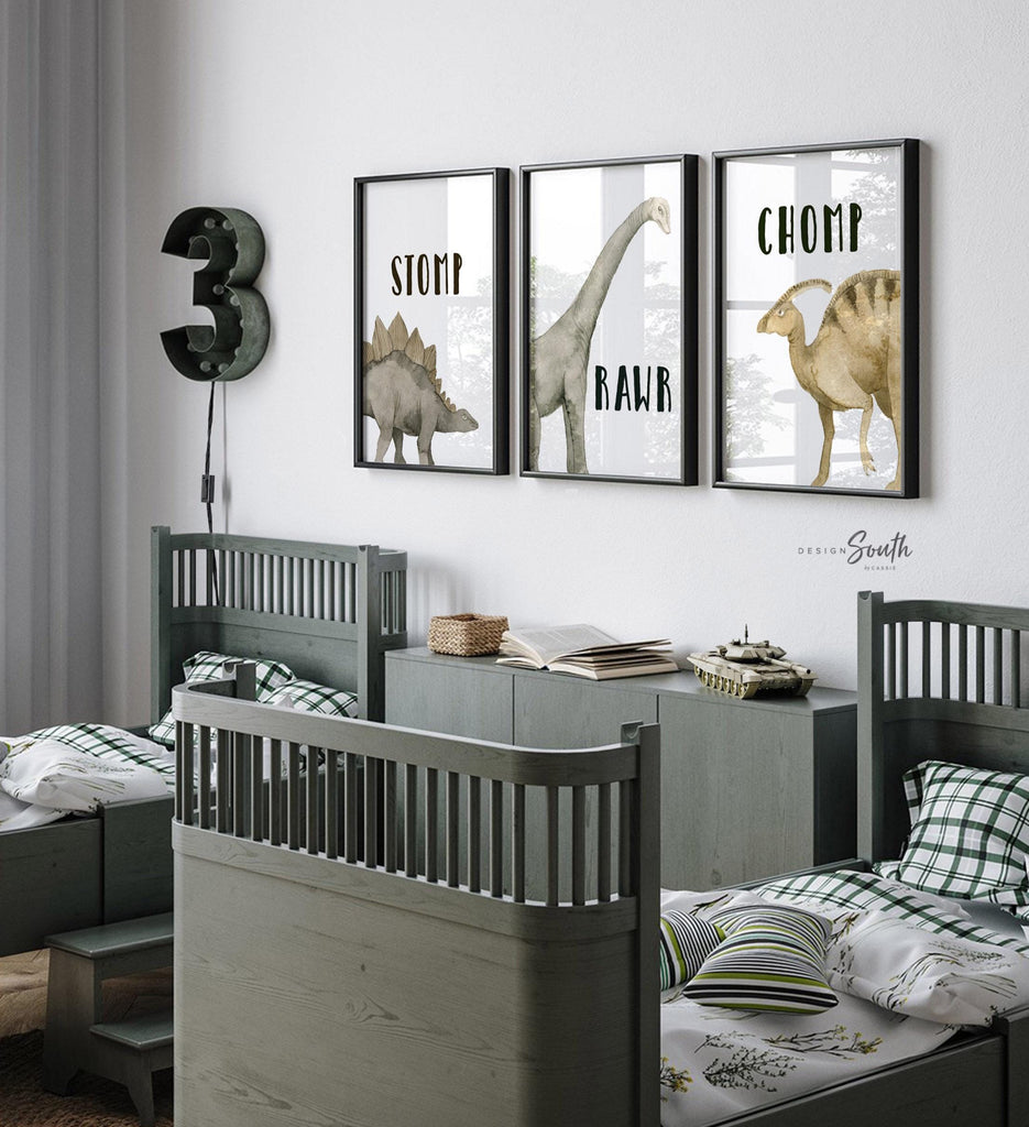 Watercolor dinosaur wall art set of 3 featuring a brachiosaurus, stegosaurus, and parasaurolophus in neutral earthy tones. Each print includes fun dinosaur-themed words: “Stomp,” “Roar,” and “Chomp,” making it perfect for a kids’ bedroom, playroom, or dinosaur-themed nursery. This playful and colorful artwork set adds a whimsical, prehistoric touch to any child’s space and makes a great gift for dino-loving toddlers or new parents decorating a gender-neutral nursery.