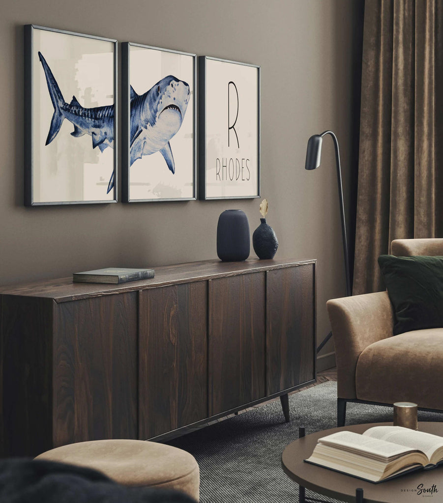 Set of shark-themed nursery wall art prints featuring a personalized boys name. Perfect for a baby boy’s room or ocean-themed nursery, this playful and modern artwork adds a fun touch to boys&#39; bedrooms or toddler spaces. Includes watercolor-style shark illustrations and bold text, ideal for a shark lover’s room or under-the-sea decor. A great gift for baby showers, birthdays, or parents creating a shark or marine life theme for their little one.