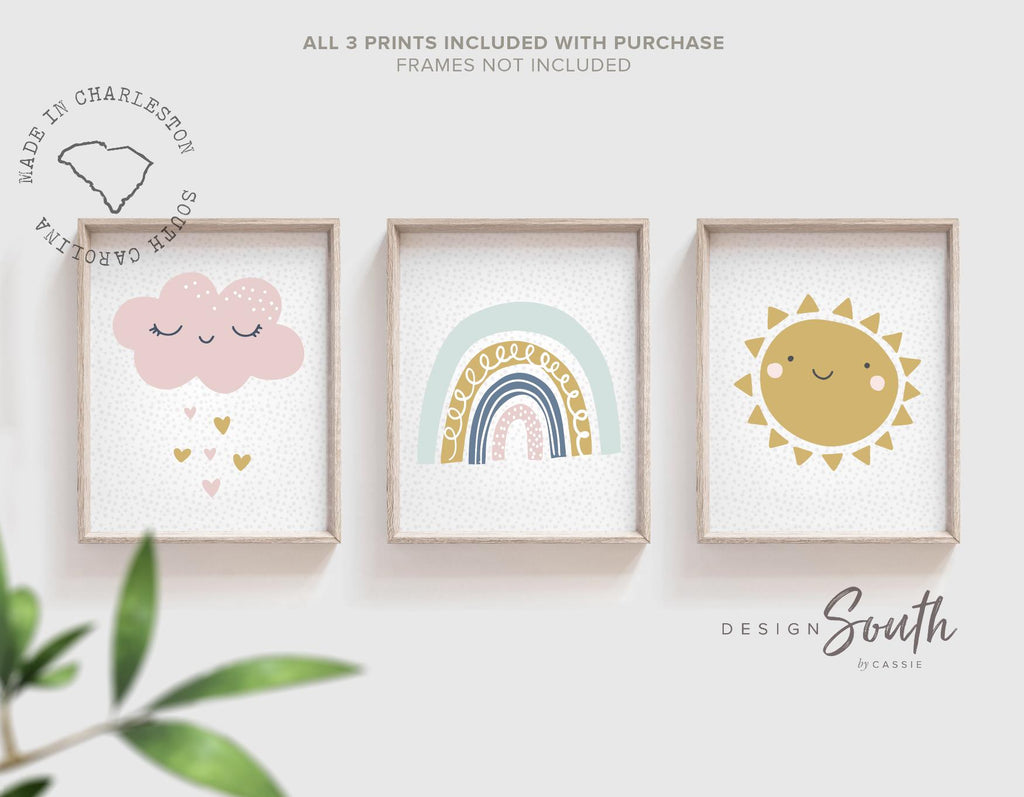 Set of 3 pastel nursery wall art prints featuring a sun, rainbow, cloud, and raining hearts design, perfect for a baby girl’s room, playroom, or toddler bedroom. These sweet and cheerful prints in soft pink, yellow, blue, and lavender tones add a whimsical and calming touch to any child’s space. Ideal for pastel-themed nurseries or rainbow baby gifts, this artwork set brings warmth and charm to your little one’s walls. A lovely decor choice for baby showers or first birthdays.