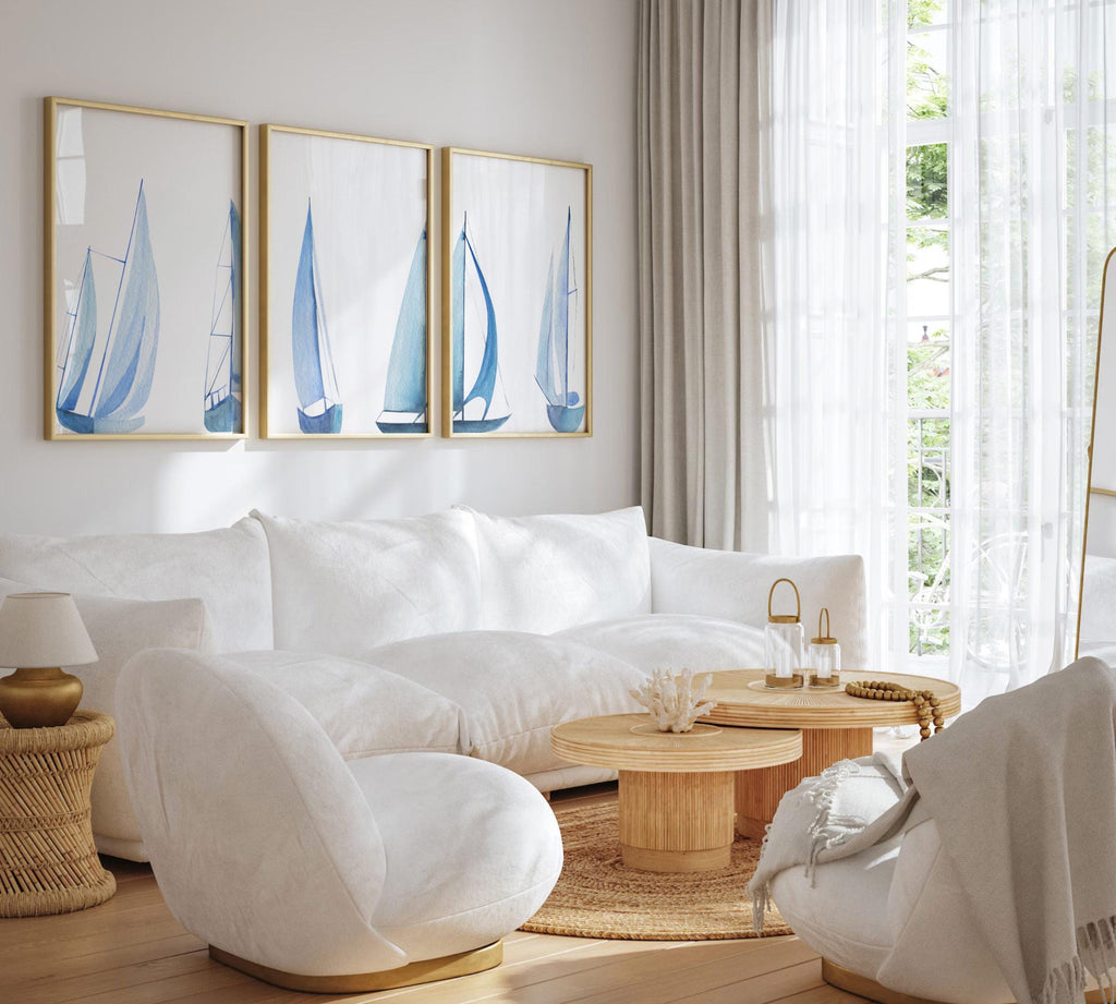 Set of 3 coastal sailboat art prints featuring watercolor paintings of sailboats on the ocean and lake. Nautical wall decor perfect for a beach house, lake house, coastal bathroom, or ocean-themed nursery. These prints showcase soft, serene colors with a calming seaside feel, ideal for summer home decor or a relaxing wall art set. Great gift for coastal lovers or sailing enthusiasts. Unframed prints available in multiple sizes for easy display and framing.