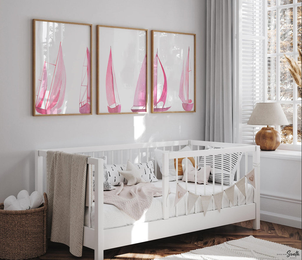 Set of 3 pink sailboat watercolor art prints featuring soft coastal scenes with ocean and lake views. These nautical wall decor pieces are perfect for a beach house, lake house, coastal bathroom, or a girl’s ocean-themed nursery. The soothing pastel tones and feminine sailing details create a light, breezy atmosphere. Ideal gift for those who love the coast, sailing, or soft pink decor. Unframed prints available in multiple sizes for versatile styling and easy framing.