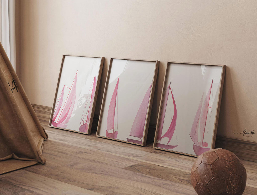 Set of 3 pink sailboat watercolor art prints featuring soft coastal scenes with ocean and lake views. These nautical wall decor pieces are perfect for a beach house, lake house, coastal bathroom, or a girl’s ocean-themed nursery. The soothing pastel tones and feminine sailing details create a light, breezy atmosphere. Ideal gift for those who love the coast, sailing, or soft pink decor. Unframed prints available in multiple sizes for versatile styling and easy framing.