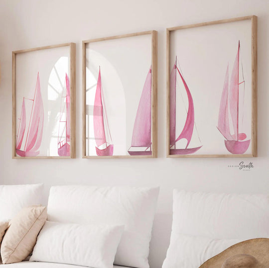 Set of 3 pink sailboat watercolor art prints featuring soft coastal scenes with ocean and lake views. These nautical wall decor pieces are perfect for a beach house, lake house, coastal bathroom, or a girl’s ocean-themed nursery. The soothing pastel tones and feminine sailing details create a light, breezy atmosphere. Ideal gift for those who love the coast, sailing, or soft pink decor. Unframed prints available in multiple sizes for versatile styling and easy framing.