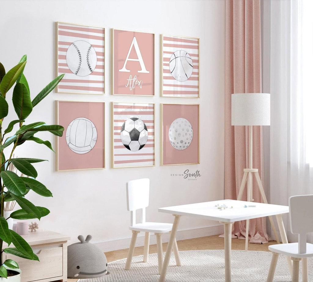 Set of 6 personalized girls sports wall art prints featuring volleyball, basketball, softball, golf, soccer, and a custom name print in a soft coral pink and gray color palette. Perfect for a baby girl nursery, toddler bedroom, or kids playroom with a sporty theme. Modern and sweet artwork designed to inspire and personalize your child&#39;s space. Ideal gift for sporty girls or custom nursery decor with a feminine touch.