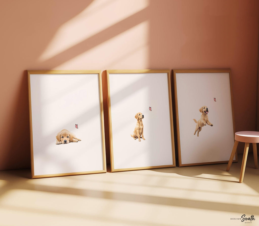 Set of 3 nursery art prints featuring golden retriever puppies playfully chasing pink butterflies. Designed in a soft, clean, and modern style, this sweet wall art set is perfect for a baby girl&#39;s nursery or toddler bedroom. The gentle color palette and simple composition create a calming and adorable atmosphere, ideal for dog lovers and parents looking to add a personalized, heartwarming touch to their child’s space.