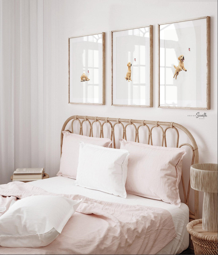 Set of 3 nursery art prints featuring golden retriever puppies playfully chasing pink butterflies. Designed in a soft, clean, and modern style, this sweet wall art set is perfect for a baby girl&#39;s nursery or toddler bedroom. The gentle color palette and simple composition create a calming and adorable atmosphere, ideal for dog lovers and parents looking to add a personalized, heartwarming touch to their child’s space.