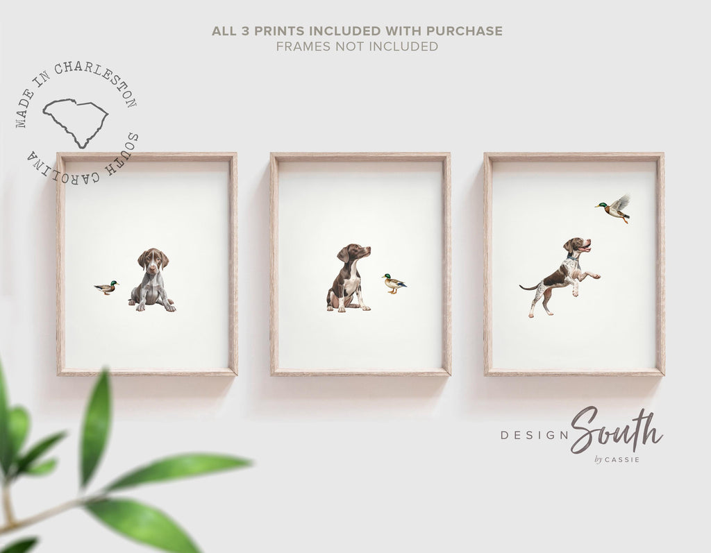 Set of 3 wall art prints featuring German Shorthaired Pointers (GSP) in a duck hunting scene, perfect for a toddler boy nursery or baby room. This series includes a pointing bird dog, a mallard duck taking flight, and a classic hunting dog stance. Designed for little boys who love the outdoors or come from hunting families, this bird dog artwork brings a rustic, adventurous feel to any space. Ideal for nurseries, playrooms, or as a unique gift for duck hunting enthusiasts.