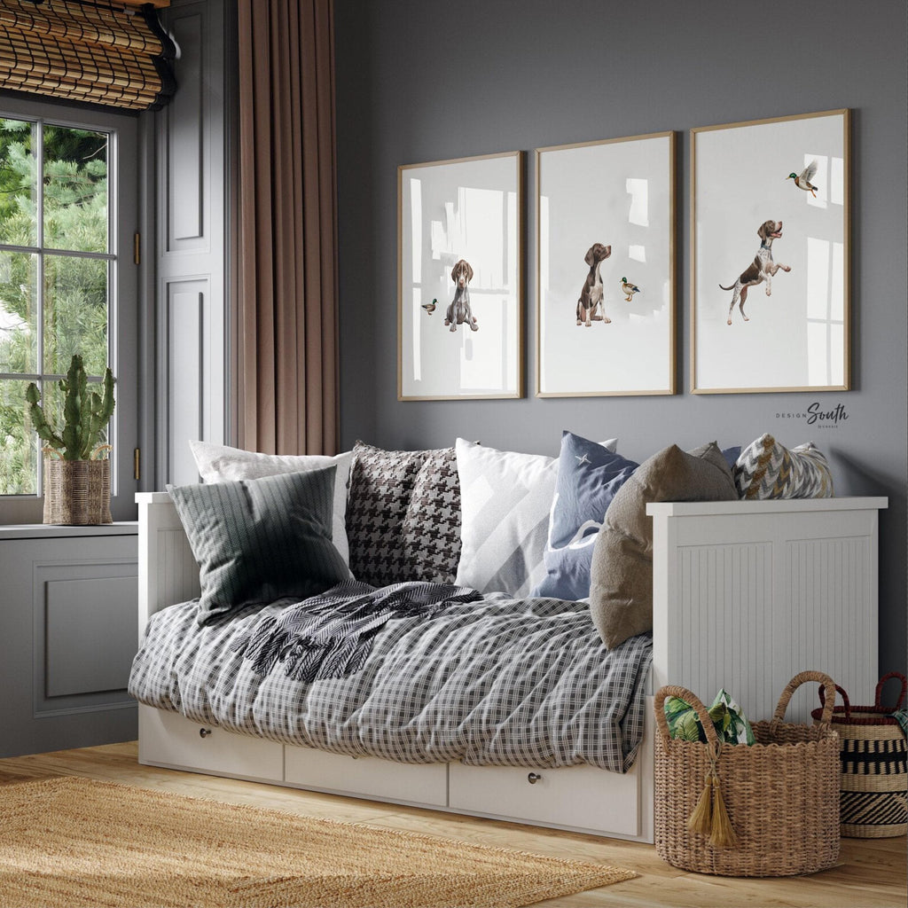 Set of 3 wall art prints featuring German Shorthaired Pointers (GSP) in a duck hunting scene, perfect for a toddler boy nursery or baby room. This series includes a pointing bird dog, a mallard duck taking flight, and a classic hunting dog stance. Designed for little boys who love the outdoors or come from hunting families, this bird dog artwork brings a rustic, adventurous feel to any space. Ideal for nurseries, playrooms, or as a unique gift for duck hunting enthusiasts.