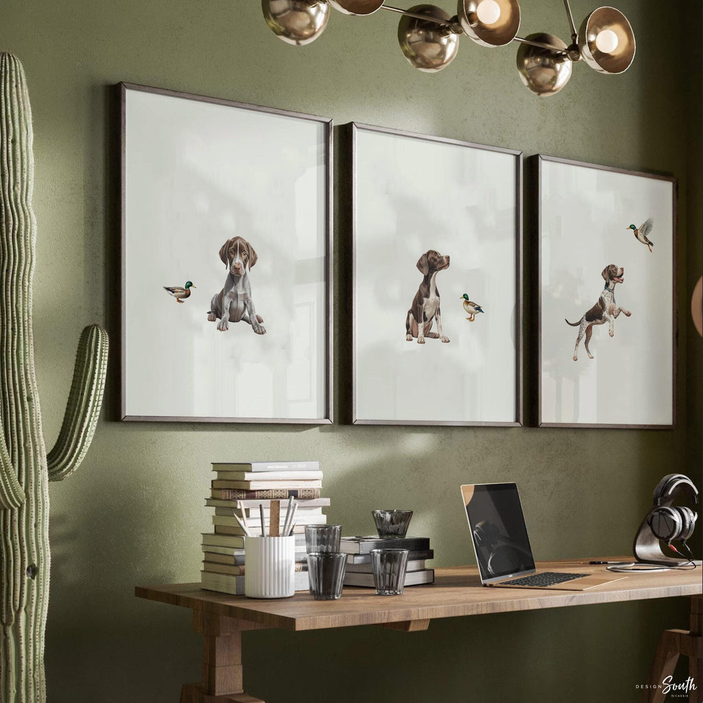 Set of 3 wall art prints featuring German Shorthaired Pointers (GSP) in a duck hunting scene, perfect for a toddler boy nursery or baby room. This series includes a pointing bird dog, a mallard duck taking flight, and a classic hunting dog stance. Designed for little boys who love the outdoors or come from hunting families, this bird dog artwork brings a rustic, adventurous feel to any space. Ideal for nurseries, playrooms, or as a unique gift for duck hunting enthusiasts.
