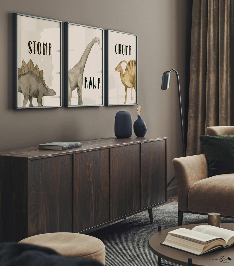 Watercolor dinosaur wall art set of 3 featuring a brachiosaurus, stegosaurus, and parasaurolophus in neutral earthy tones. Each print includes fun dinosaur-themed words: “Stomp,” “Roar,” and “Chomp,” making it perfect for a kids’ bedroom, playroom, or dinosaur-themed nursery. This playful and colorful artwork set adds a whimsical, prehistoric touch to any child’s space and makes a great gift for dino-loving toddlers or new parents decorating a gender-neutral nursery.