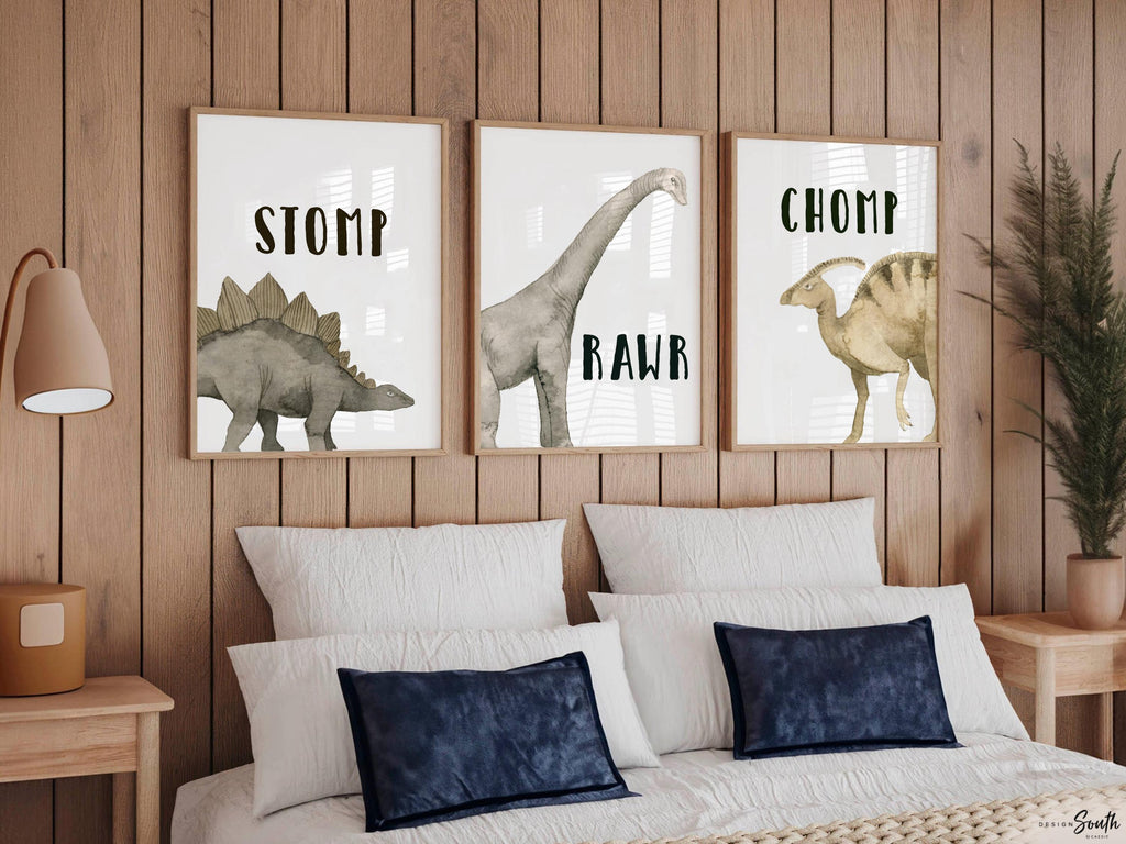 Watercolor dinosaur wall art set of 3 featuring a brachiosaurus, stegosaurus, and parasaurolophus in neutral earthy tones. Each print includes fun dinosaur-themed words: “Stomp,” “Roar,” and “Chomp,” making it perfect for a kids’ bedroom, playroom, or dinosaur-themed nursery. This playful and colorful artwork set adds a whimsical, prehistoric touch to any child’s space and makes a great gift for dino-loving toddlers or new parents decorating a gender-neutral nursery.