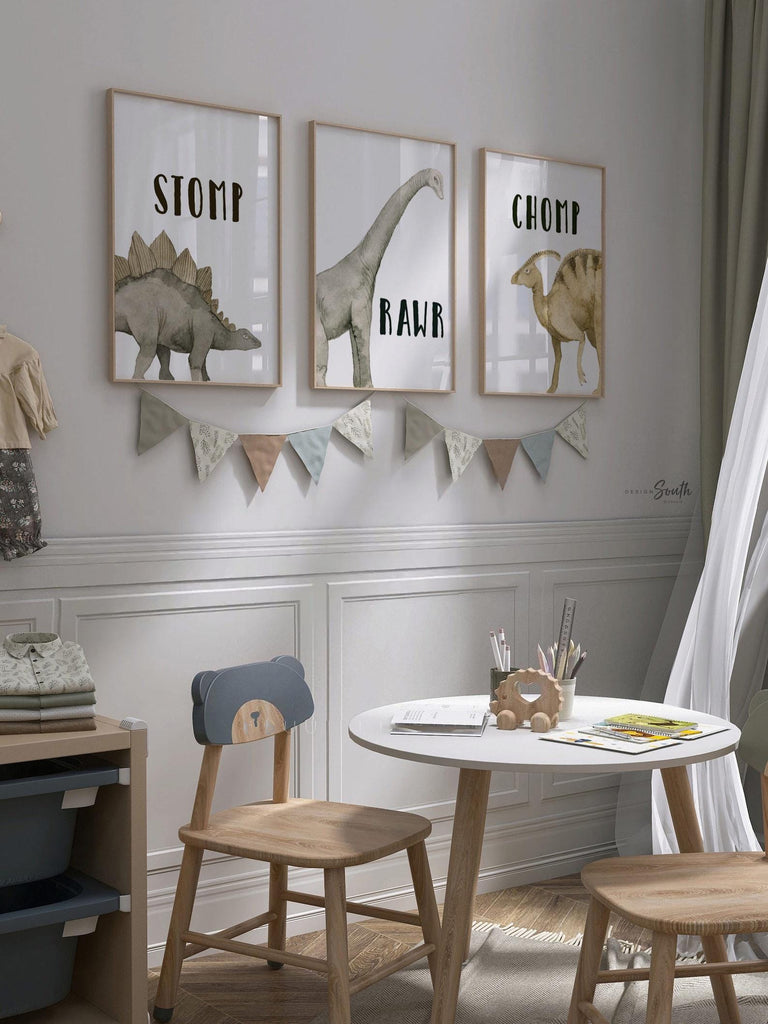 Watercolor dinosaur wall art set of 3 featuring a brachiosaurus, stegosaurus, and parasaurolophus in neutral earthy tones. Each print includes fun dinosaur-themed words: “Stomp,” “Roar,” and “Chomp,” making it perfect for a kids’ bedroom, playroom, or dinosaur-themed nursery. This playful and colorful artwork set adds a whimsical, prehistoric touch to any child’s space and makes a great gift for dino-loving toddlers or new parents decorating a gender-neutral nursery.