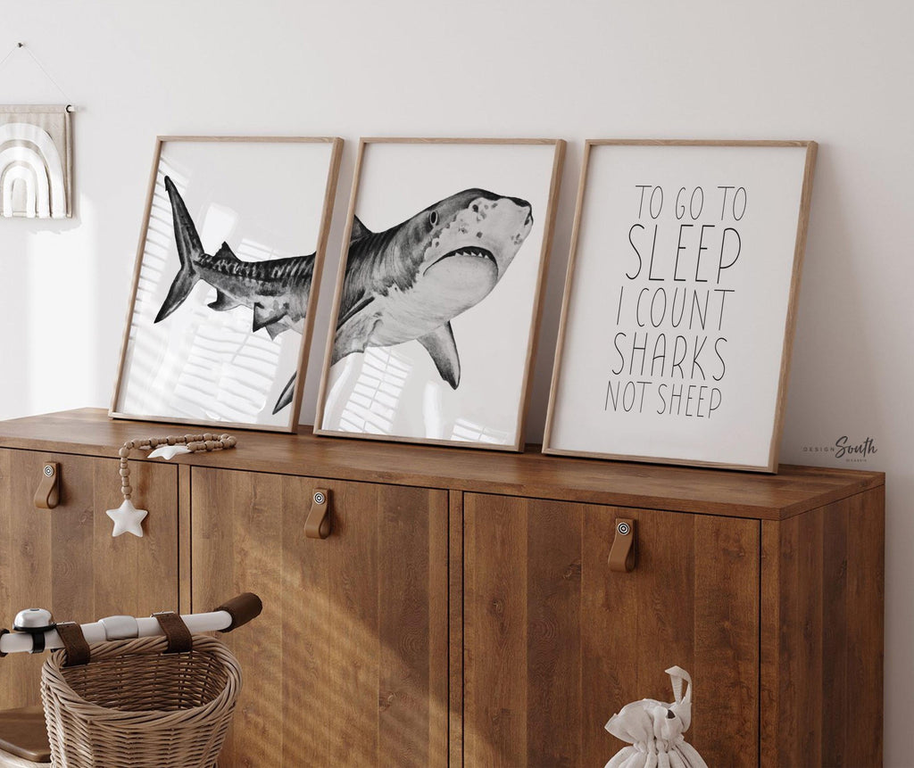Set of shark-themed nursery wall art prints featuring the quote “To go to sleep I count sharks not sheep.” Perfect for a baby boy’s room or ocean-themed nursery, this playful and modern artwork adds a fun touch to boys&#39; bedrooms or toddler spaces. Includes watercolor-style shark illustrations and bold text, ideal for a shark lover’s room or under-the-sea decor. A great gift for baby showers, birthdays, or parents creating a shark or marine life theme for their little one.