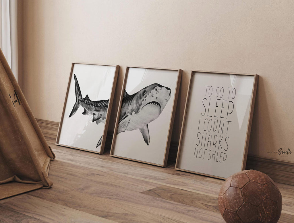 Set of shark-themed nursery wall art prints featuring the quote “To go to sleep I count sharks not sheep.” Perfect for a baby boy’s room or ocean-themed nursery, this playful and modern artwork adds a fun touch to boys&#39; bedrooms or toddler spaces. Includes watercolor-style shark illustrations and bold text, ideal for a shark lover’s room or under-the-sea decor. A great gift for baby showers, birthdays, or parents creating a shark or marine life theme for their little one.