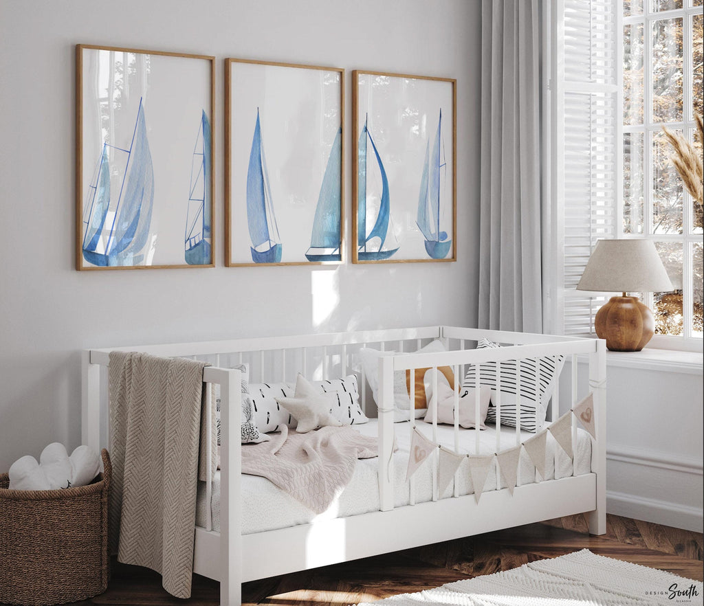 Set of 3 coastal sailboat art prints featuring watercolor paintings of sailboats on the ocean and lake. Nautical wall decor perfect for a beach house, lake house, coastal bathroom, or ocean-themed nursery. These prints showcase soft, serene colors with a calming seaside feel, ideal for summer home decor or a relaxing wall art set. Great gift for coastal lovers or sailing enthusiasts. Unframed prints available in multiple sizes for easy display and framing.