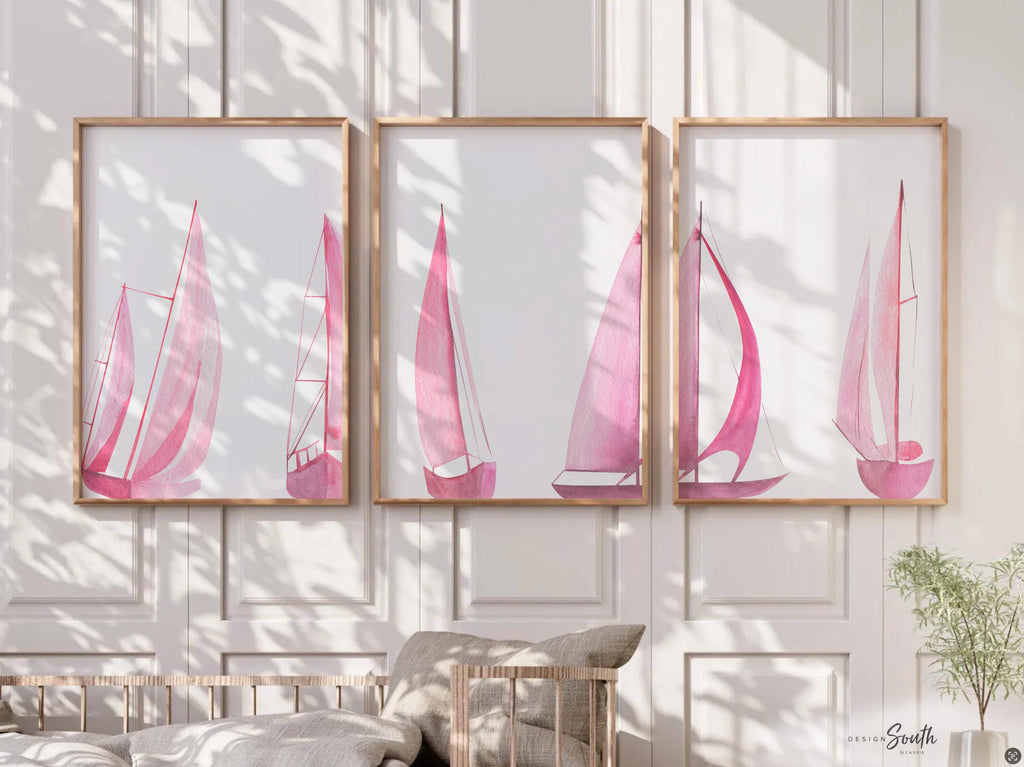 Set of 3 pink sailboat watercolor art prints featuring soft coastal scenes with ocean and lake views. These nautical wall decor pieces are perfect for a beach house, lake house, coastal bathroom, or a girl’s ocean-themed nursery. The soothing pastel tones and feminine sailing details create a light, breezy atmosphere. Ideal gift for those who love the coast, sailing, or soft pink decor. Unframed prints available in multiple sizes for versatile styling and easy framing.