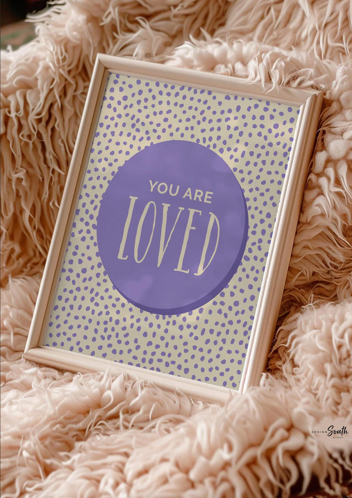 Set of 6 inspirational wall art prints for kids featuring rainbow-colored circles with modern speckled designs. Each print includes a positive affirmation: you are loved, you are kind, you are brave, you are smart, you are strong. Designed in purple, blue, green, pink, orange, and yellow for a vibrant and trendy playroom or nursery. This uplifting art set is perfect for encouraging confidence and positivity in babies, toddlers, or young children’s spaces.