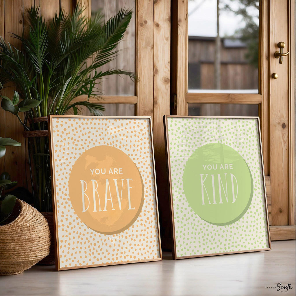 Set of 6 inspirational wall art prints for kids featuring rainbow-colored circles with modern speckled designs. Each print includes a positive affirmation: you are loved, you are kind, you are brave, you are smart, you are strong. Designed in purple, blue, green, pink, orange, and yellow for a vibrant and trendy playroom or nursery. This uplifting art set is perfect for encouraging confidence and positivity in babies, toddlers, or young children’s spaces.