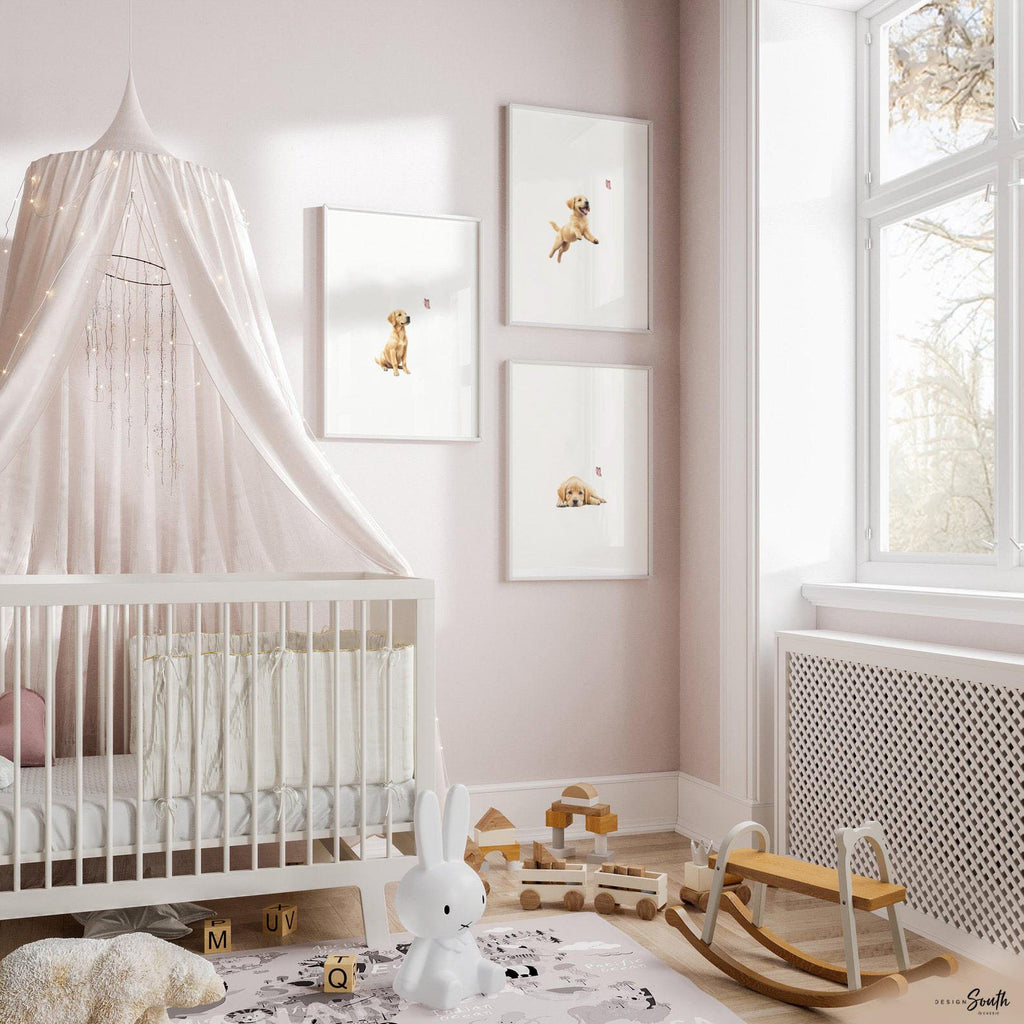 Set of 3 nursery art prints featuring golden retriever puppies playfully chasing pink butterflies. Designed in a soft, clean, and modern style, this sweet wall art set is perfect for a baby girl&#39;s nursery or toddler bedroom. The gentle color palette and simple composition create a calming and adorable atmosphere, ideal for dog lovers and parents looking to add a personalized, heartwarming touch to their child’s space.