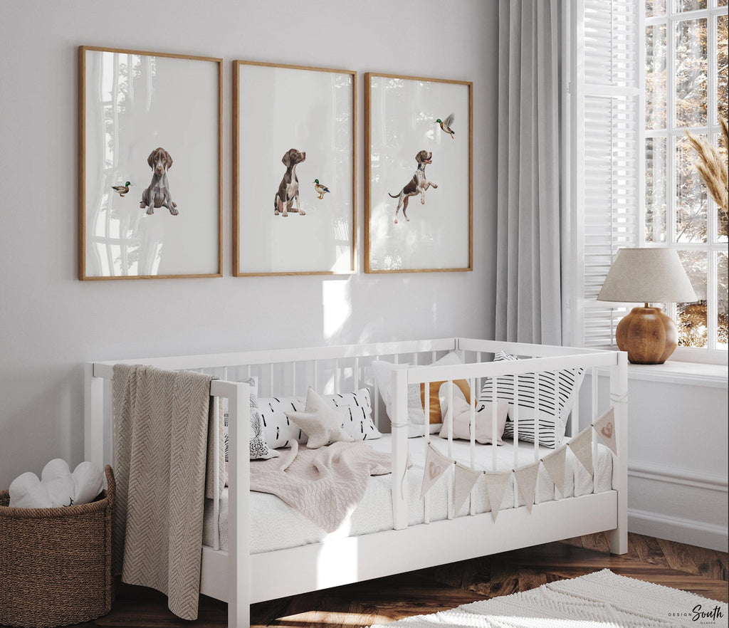 Set of 3 wall art prints featuring German Shorthaired Pointers (GSP) in a duck hunting scene, perfect for a toddler boy nursery or baby room. This series includes a pointing bird dog, a mallard duck taking flight, and a classic hunting dog stance. Designed for little boys who love the outdoors or come from hunting families, this bird dog artwork brings a rustic, adventurous feel to any space. Ideal for nurseries, playrooms, or as a unique gift for duck hunting enthusiasts.