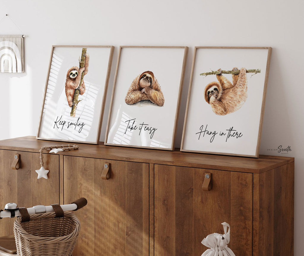 Sloth wall art set featuring 3 adorable sloth prints with inspirational quotes, perfect for a child’s bedroom or sloth-themed room. These playful and calming designs showcase hanging sloths in charming poses, adding a whimsical and relaxing vibe to nursery or kids' room decor. Ideal for sloth lovers, this wall art brings a sense of peace and fun, making it a sweet and cozy addition to any child’s space.









