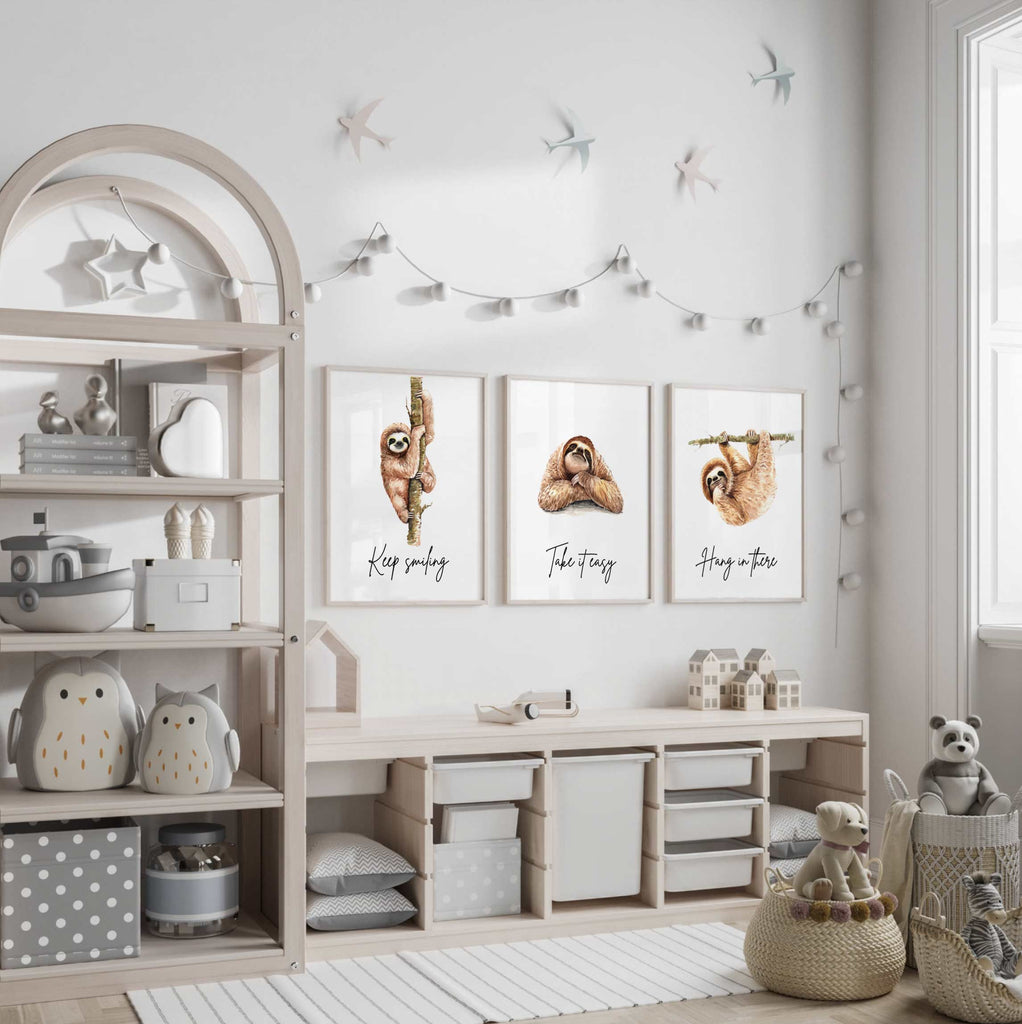 Sloth wall art set featuring 3 adorable sloth prints with inspirational quotes, perfect for a child’s bedroom or sloth-themed room. These playful and calming designs showcase hanging sloths in charming poses, adding a whimsical and relaxing vibe to nursery or kids' room decor. Ideal for sloth lovers, this wall art brings a sense of peace and fun, making it a sweet and cozy addition to any child’s space.









