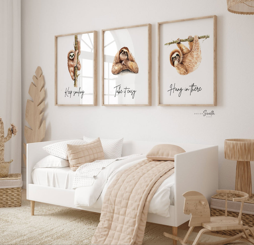 Sloth wall art set featuring 3 adorable sloth prints with inspirational quotes, perfect for a child’s bedroom or sloth-themed room. These playful and calming designs showcase hanging sloths in charming poses, adding a whimsical and relaxing vibe to nursery or kids' room decor. Ideal for sloth lovers, this wall art brings a sense of peace and fun, making it a sweet and cozy addition to any child’s space.









